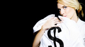 Woman-holding-bag-of-money-via-Shutterstock
